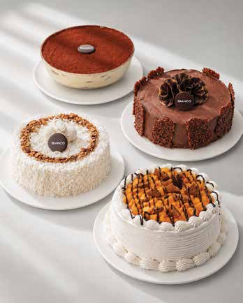 A selection of Bianco signature cakes, including tiramisu, chocolate, coconut and caramel